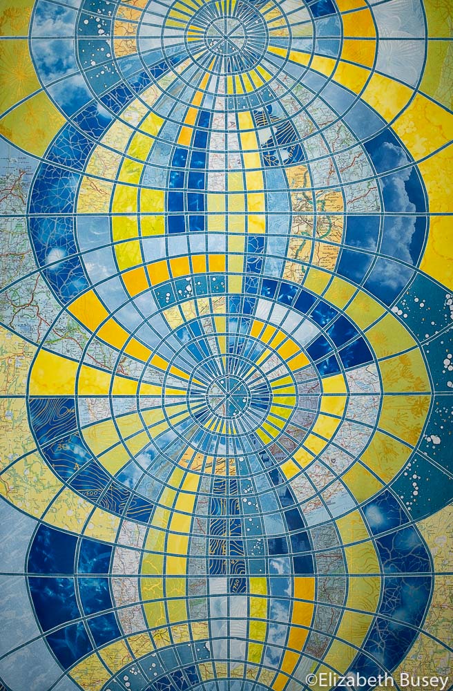 Vertical monoprint collage globe transformation blues yellow-green orange stained glass cyanotype vintage maps Elizabeth Busey 36 x 24 inch
